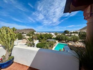 a view from the balcony of a villa with a swimming pool at La Washingtonia in Las Negras