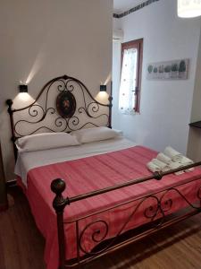 Posteľ alebo postele v izbe v ubytovaní Le Rocce Holiday Rooms