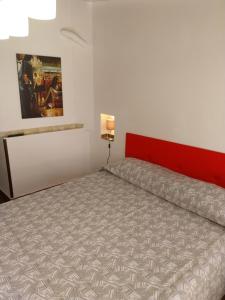 Posteľ alebo postele v izbe v ubytovaní Le Rocce Holiday Rooms