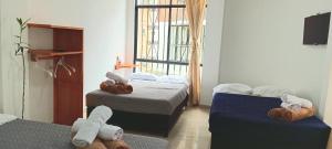 Letto o letti in una camera di Bambu Hostel