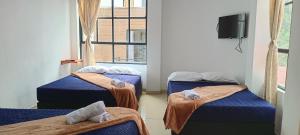 Letto o letti in una camera di Bambu Hostel