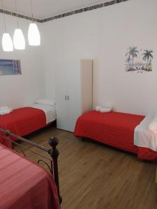 Posteľ alebo postele v izbe v ubytovaní Le Rocce Holiday Rooms