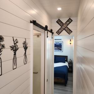 a door leading to a bedroom with a bed at Porto Station Patio & Bbq Stylish Stay in Fredericksburg +31 photos
