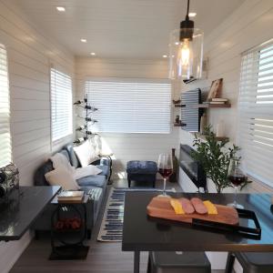 a living room with a table and a couch at Porto Station Patio & Bbq Stylish Stay in Fredericksburg