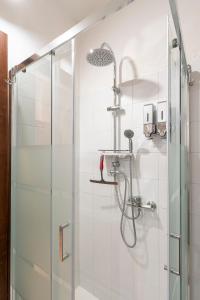 a bathroom with a shower with a glass door at Nonna Lina in Castel di Ieri