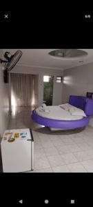 Ένα ή περισσότερα κρεβάτια σε δωμάτιο στο hotel 1001 noite