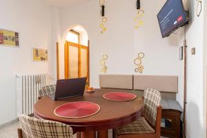 a room with a table with a laptop on it at Nonna Lina in Castel di Ieri