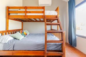 a bunk bed in a room with a bunk bedutenewayeway at Casa Fe- Newly Renovated 2 bedroom condo in Ocotal +22 photos