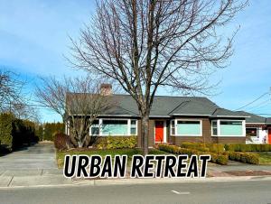 a house with a sign that reads urban retreat at Sq Urban Retreat in Sequim