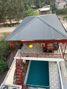 an overhead view of a house with a pool at Tamcoc Sunseekers Homestay & Hostel in Ninh Binh +49 photos