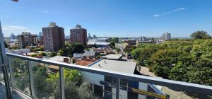 a view of a city from the balcony of a building at Departamento en Puerto Santa Fe in Santa Fe