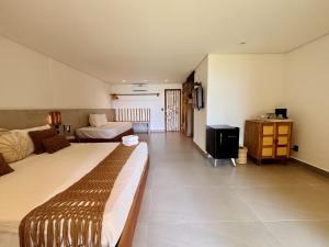 Katil atau katil-katil dalam bilik di Hotel Pousada Pitinga