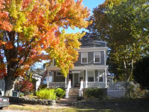 a house in the fall with trees changing colors at Fleetwood House Bed and Breakfast in Portland