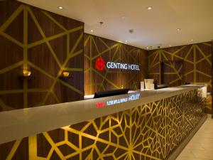 a large lobby with a large clock on the wall at Genting Hotel at Resorts World Birmingham in Bickenhill