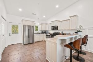 a kitchen with white cabinets and a counter top at The Oasis on Lake Hamilton with Pool in Hot Springs