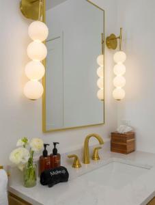 a bathroom with a sink and a mirror at Private Garden and Tranquil Haven in Summerland +17 photos