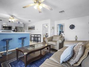 a living room with a couch and a table at Spacious Stay, Family Comfort, Quiet Escape in Plant City +17 photos