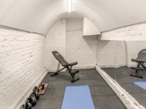 an empty room with two chairs and a table at Riverside Georgian House with Hot Tub, Sauna & Parking in Selby