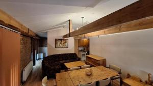 a living room with a couch and a table at Apartment SKAISTUMS in Jūrmala