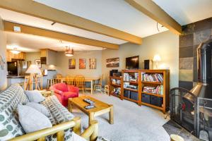 a living room with a couch and a fireplace at Silverthorne Condo with Lake Views 10 Mi to Skiing! in Silverthorne
