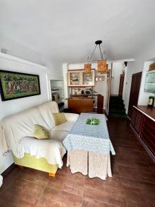 a living room with a couch and a table at Alcalá zona centro duplex in Alcalá la Real