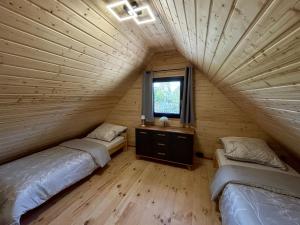 Postel nebo postele na pokoji v ubytování Domek letniskowy Zacisze 2 + 29 fotografií