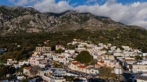 an aerial view of a town in front of a mountain at Casa Moderna in Fourfourás