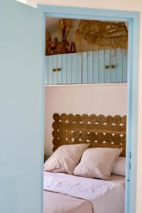 Ένα ή περισσότερα κρεβάτια σε δωμάτιο στο La Casa Blau Maison de charme avec piscine