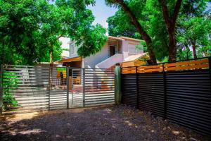 a fence in front of a house at The Dawn cottage in Moshi