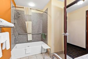 a bathroom with a tub and a shower at Best Western Kenosha Inn in Broken Arrow +21 photos