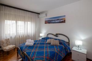 En eller flere senge i et værelse på Casa Vacanze Heidi vista lago