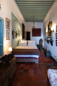 a bedroom with a large bed in a room at Aux 3 Portes in Tangier +212 photos