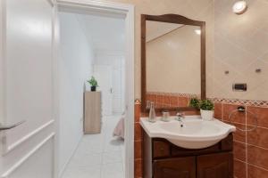 a bathroom with a sink and a mirror at Apartamento Bonjour in Tenerife +21 photos
