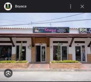 a store with a sign on the front of it at Hotel kerana moon in Puerto Boyacá