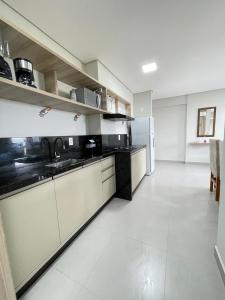 Kuchyň nebo kuchyňský kout v ubytování R02 - 806 Apto Tucano