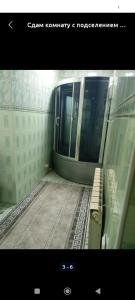 a view of a subway train with a bench at Good house 33 in Bishkek