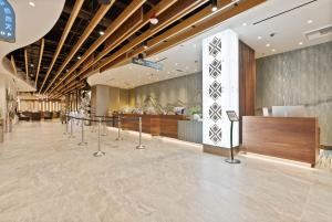 a lobby of a hotel with a table and a counter at Spokane Tribe Resort and Casino in Airway Heights