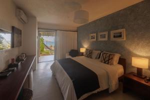 Postel nebo postele na pokoji v ubytování Hotel Maitei + 34 fotografií