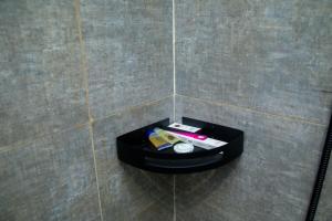 a black box on the floor of a bathroom at Quiet Studio with Smart Entry Roses in Jeddah