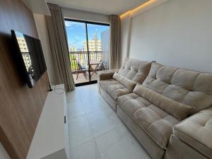 Μια τηλεόραση ή/και κέντρο ψυχαγωγίας στο Apto com quarto e sala super varanda e vista AH705