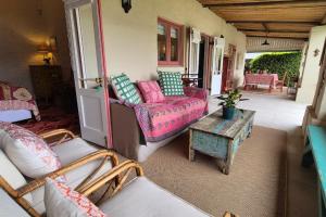 a living room with a couch and a table at Bramber cottage Stay a while in Stanford