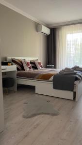 a bedroom with a large bed and a desk at Luxury Stays Kapana Plovdiv in Plovdiv +41 photos