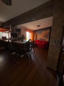 a living room with a table and chairs and a couch at Piso Moderno Puerto de la Cruz Villa Isabel in Puerto de la Cruz