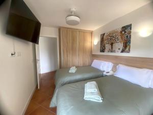 Postel nebo postele na pokoji v ubytování APARTAMENTO EN EL CENTRO CERCA DE La PLAYA
