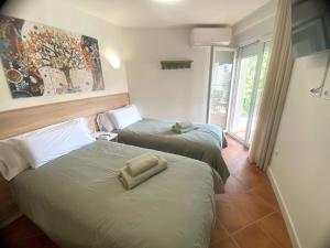 Postel nebo postele na pokoji v ubytování APARTAMENTO EN EL CENTRO CERCA DE La PLAYA
