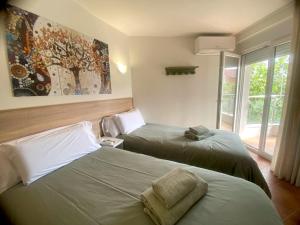 Postel nebo postele na pokoji v ubytování APARTAMENTO EN EL CENTRO CERCA DE La PLAYA