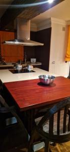 a kitchen with a wooden table with bowls on it at Piso Moderno Puerto de la Cruz Villa Isabel in Puerto de la Cruz