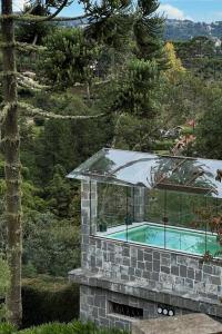 Bazén v ubytování Mansão Olhos Verdes - Luxuosa - com Hidro e Piscina aquecida nebo v jeho okolí