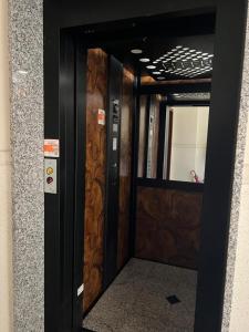 a door in a building with a sign on it at Appartamento luminoso in Parma