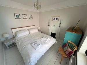 Ένα ή περισσότερα κρεβάτια σε δωμάτιο στο Billie's seaside retreat
